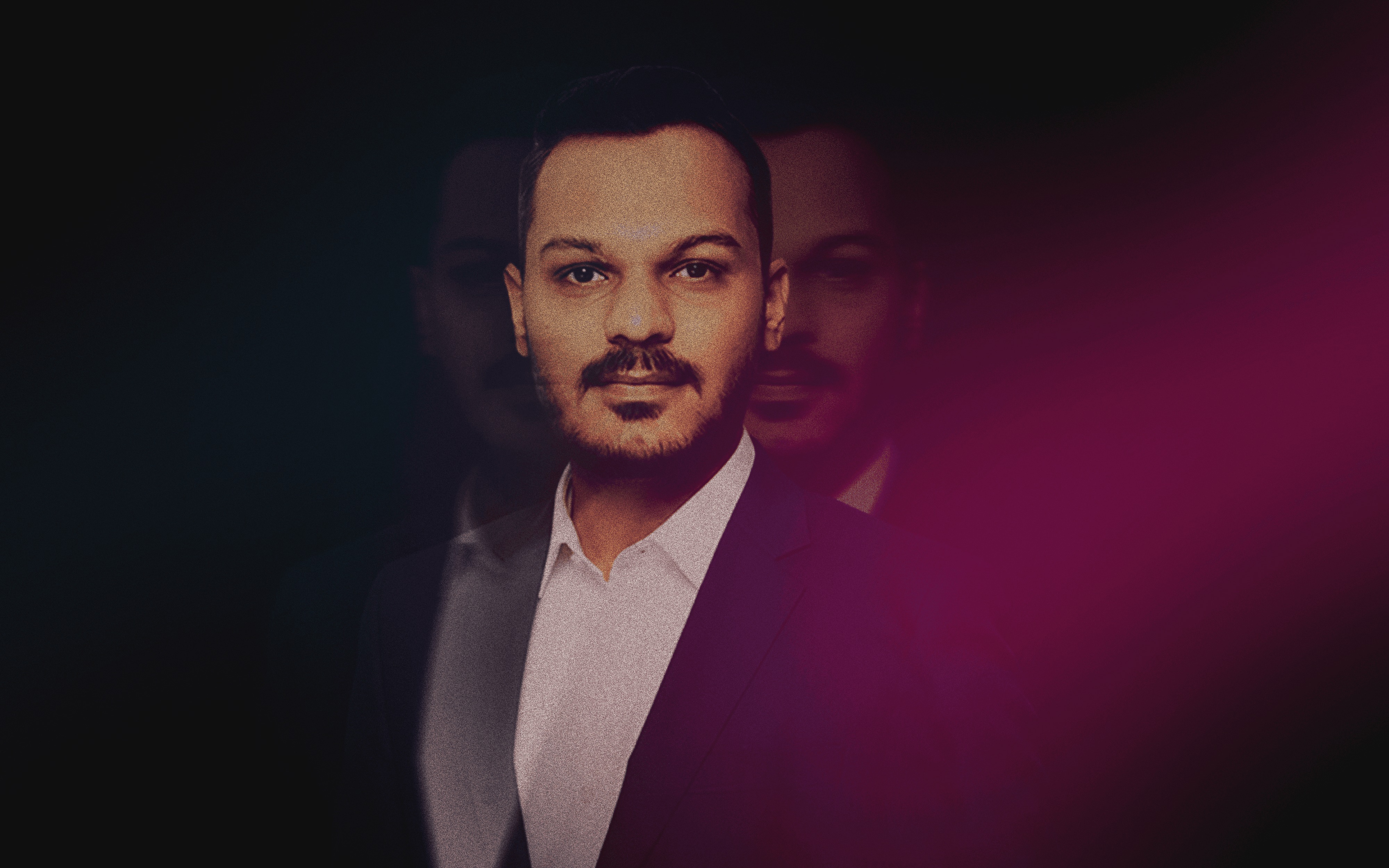 Artistic portrait with red and blue lighting creating a dramatic effect