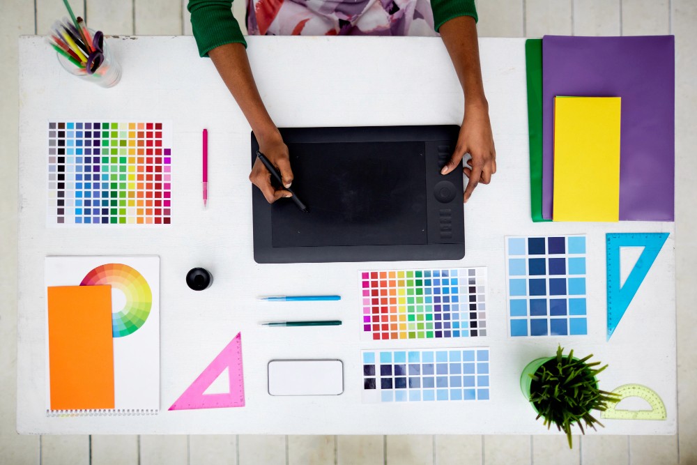 Person working with color charts and palettes