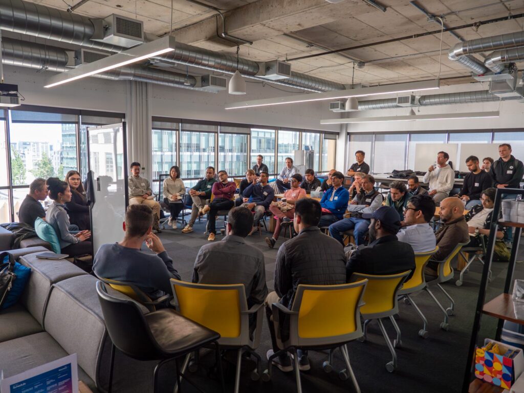 group of people gathered in a circle at the event