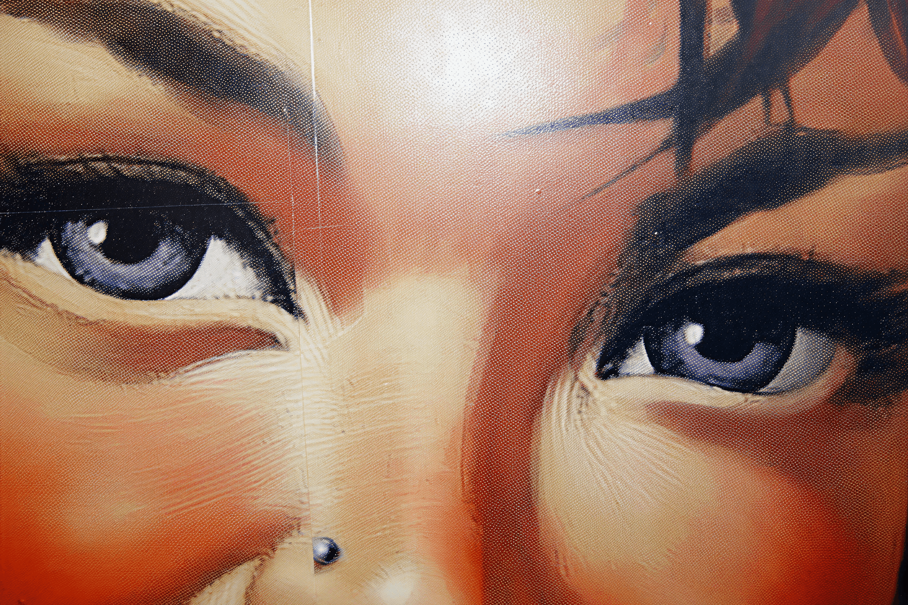 Close up of woman's eyes and nose piercing