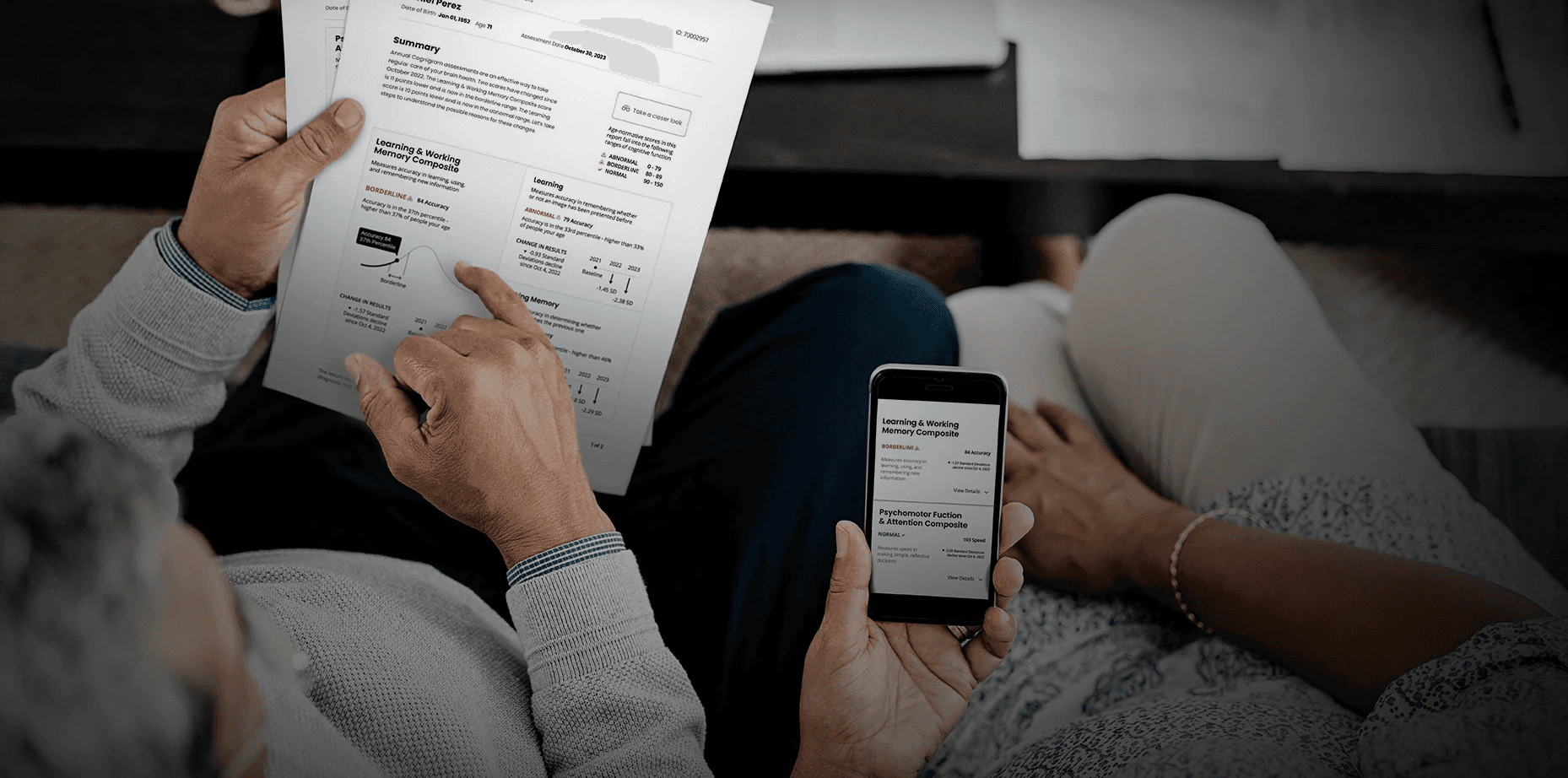 Older couple reviews the redesigned Cognigram report with simplified visuals, clear summaries, and an easy-to-read mobile version.