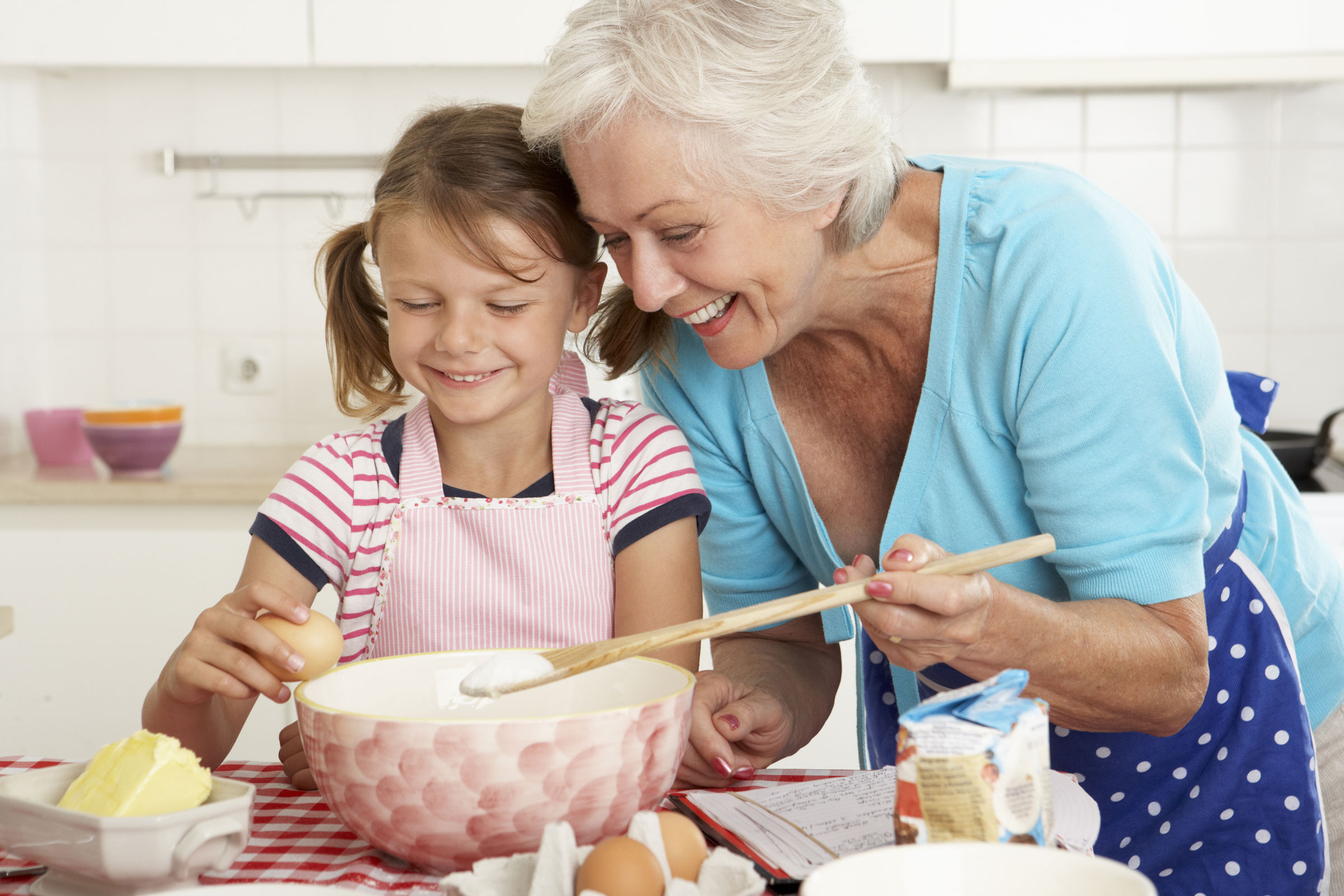 Grandmother and granddaughter baking