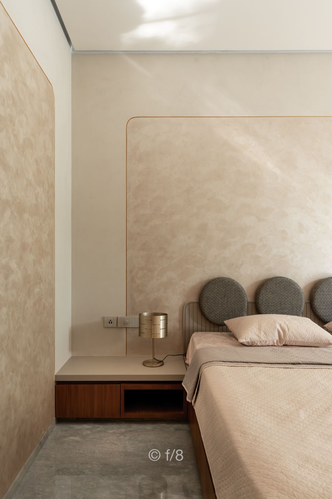 brown and white couch beside window