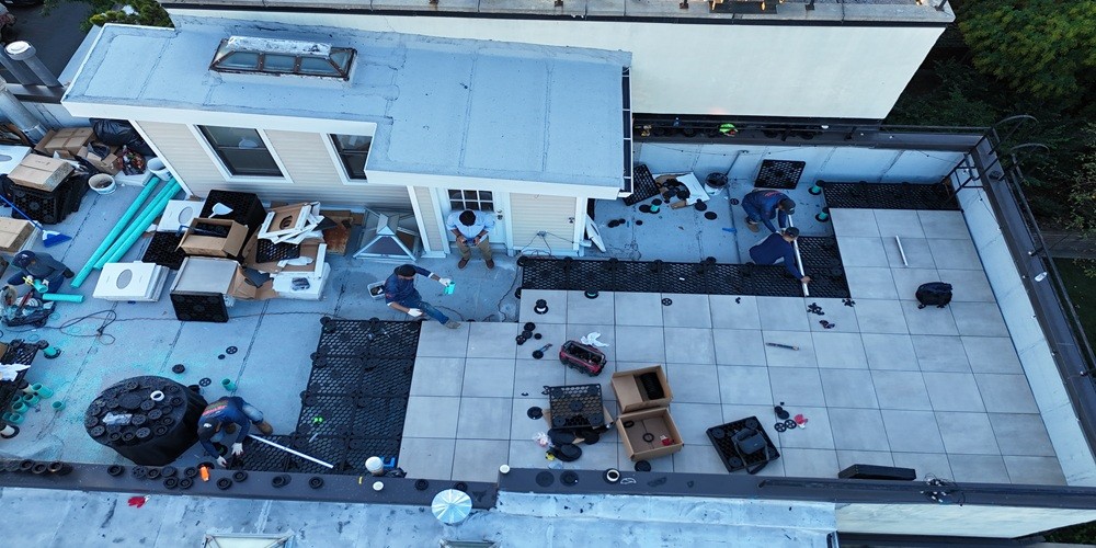 Rooftop deck building is in progress showing custom rooftop decking work by Jewel Construction