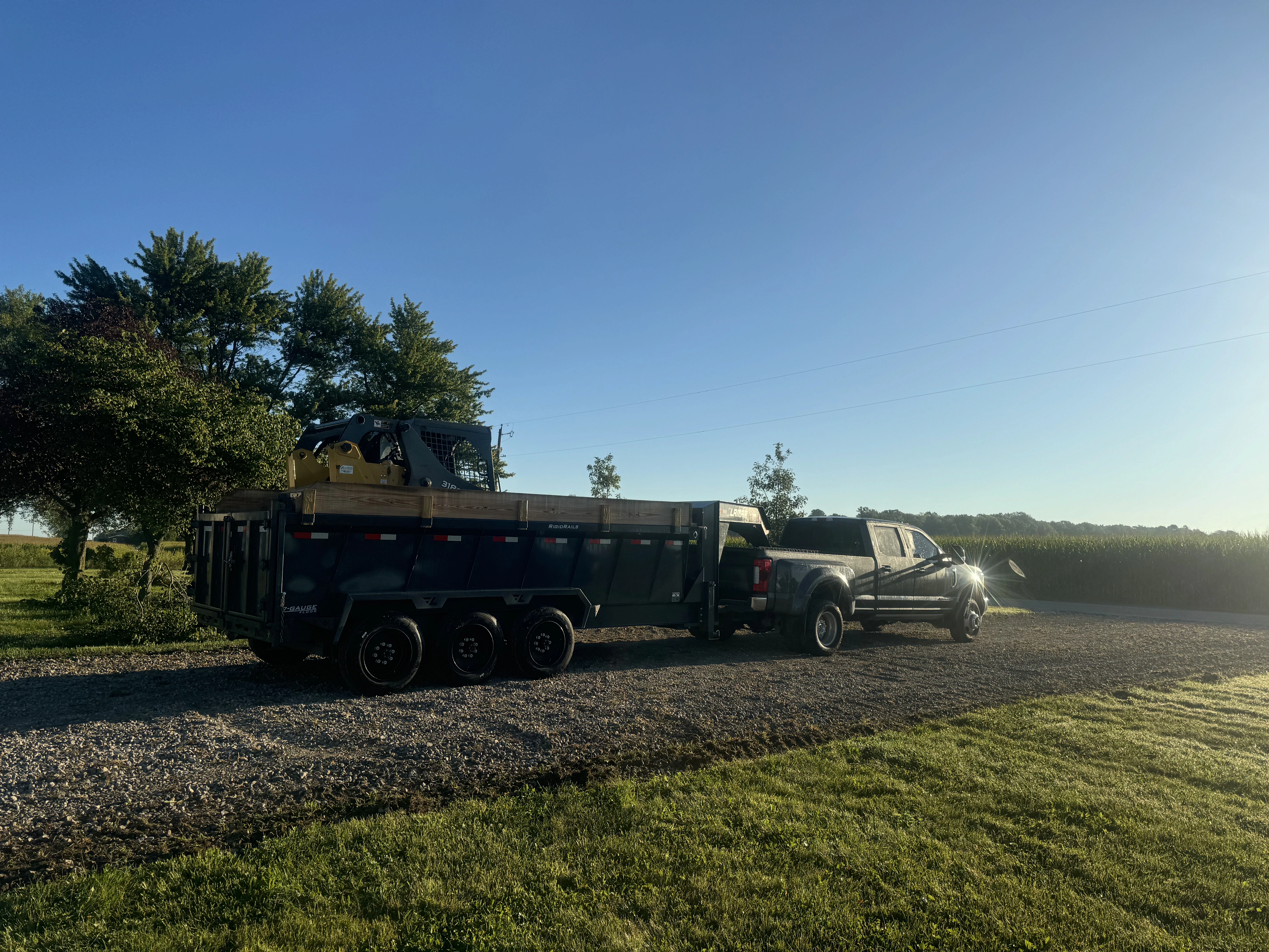 gray building surrounded by plants during golden hour