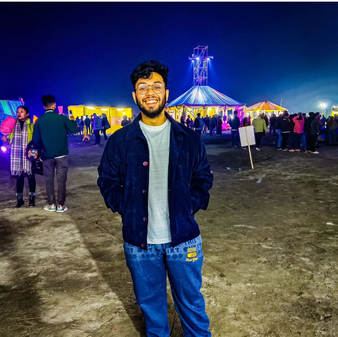 man in gray hoodie smiling