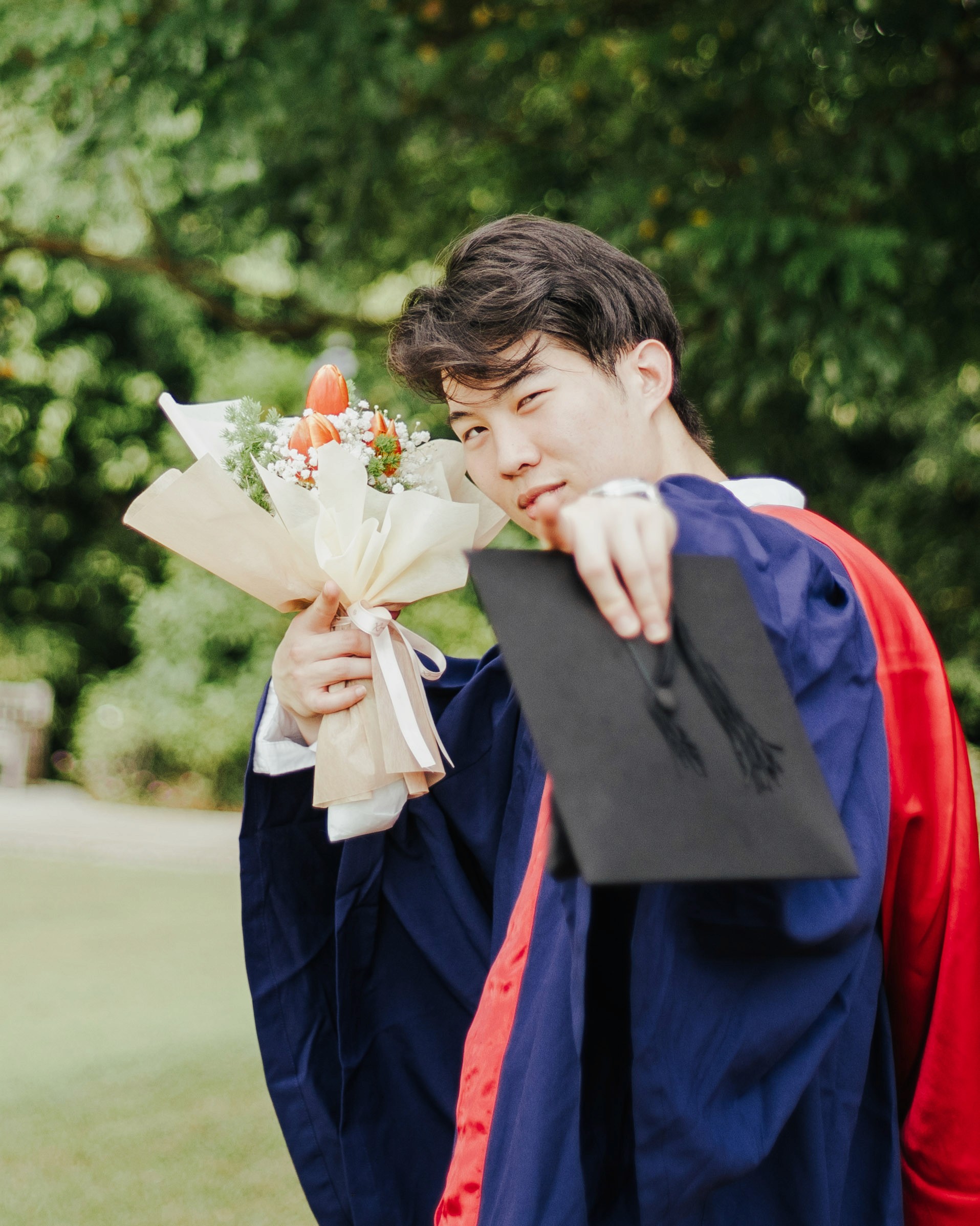 Graduation cap and gown family photoshoot in Singapore at Botanic Gardens by JIREHTAKESPHOTOS