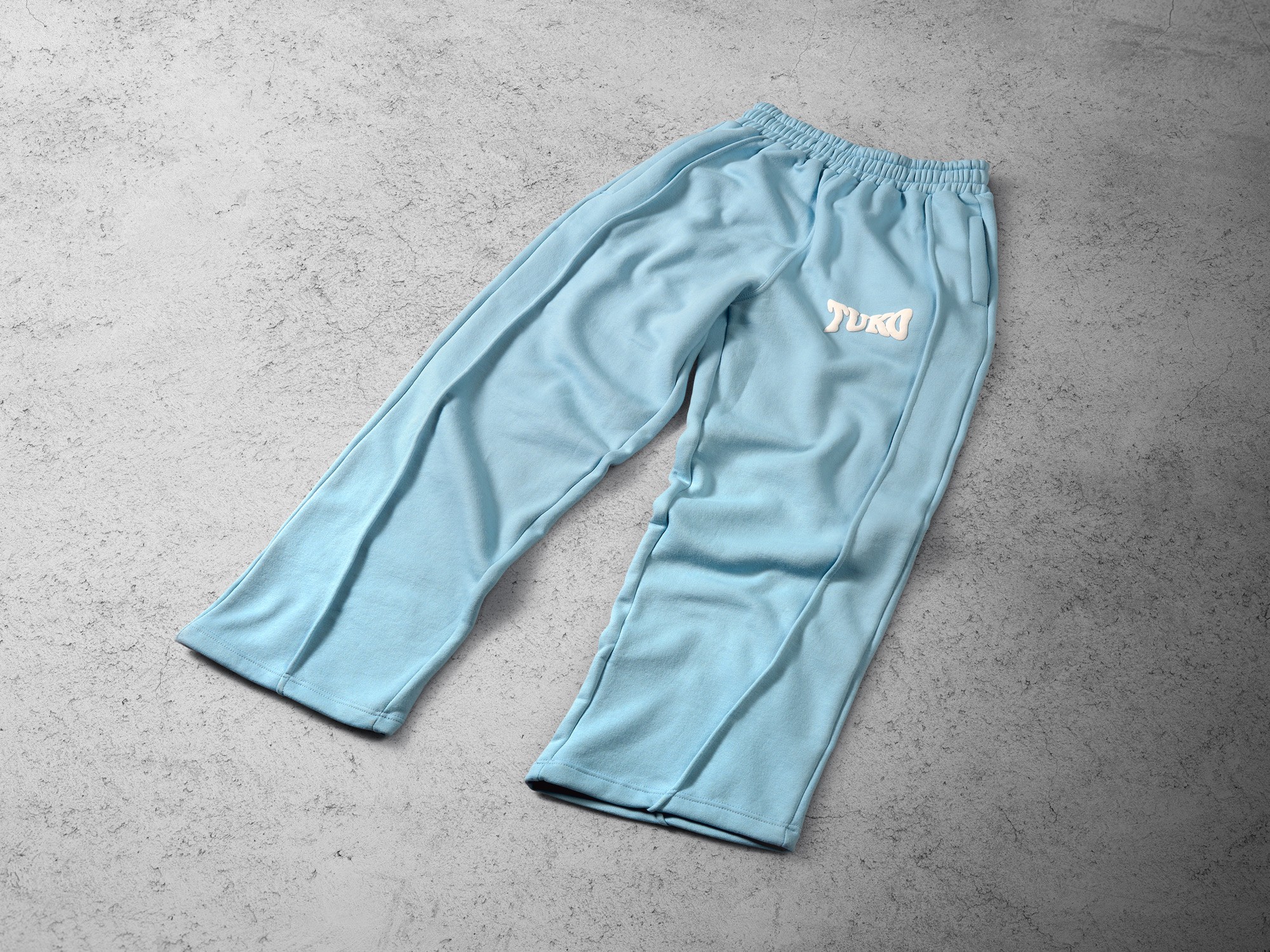 Tuko Clothing blue Dandadan inspired joggers photographer by Matthew Brown (London product photographer).