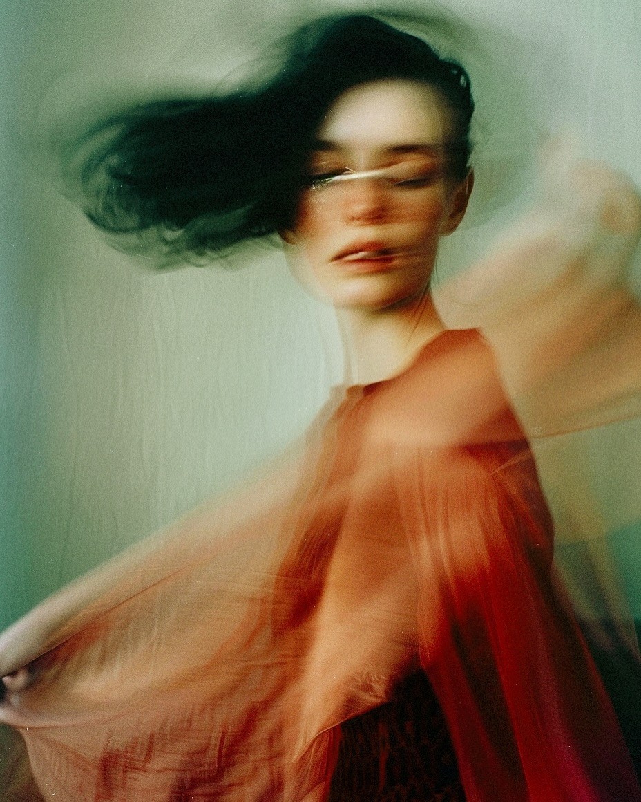 a black background with purple and orange shapes