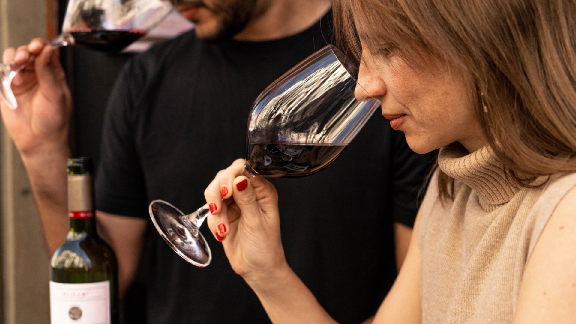 Sommelier guiding guests through a wine tasting experience in Barcelona.