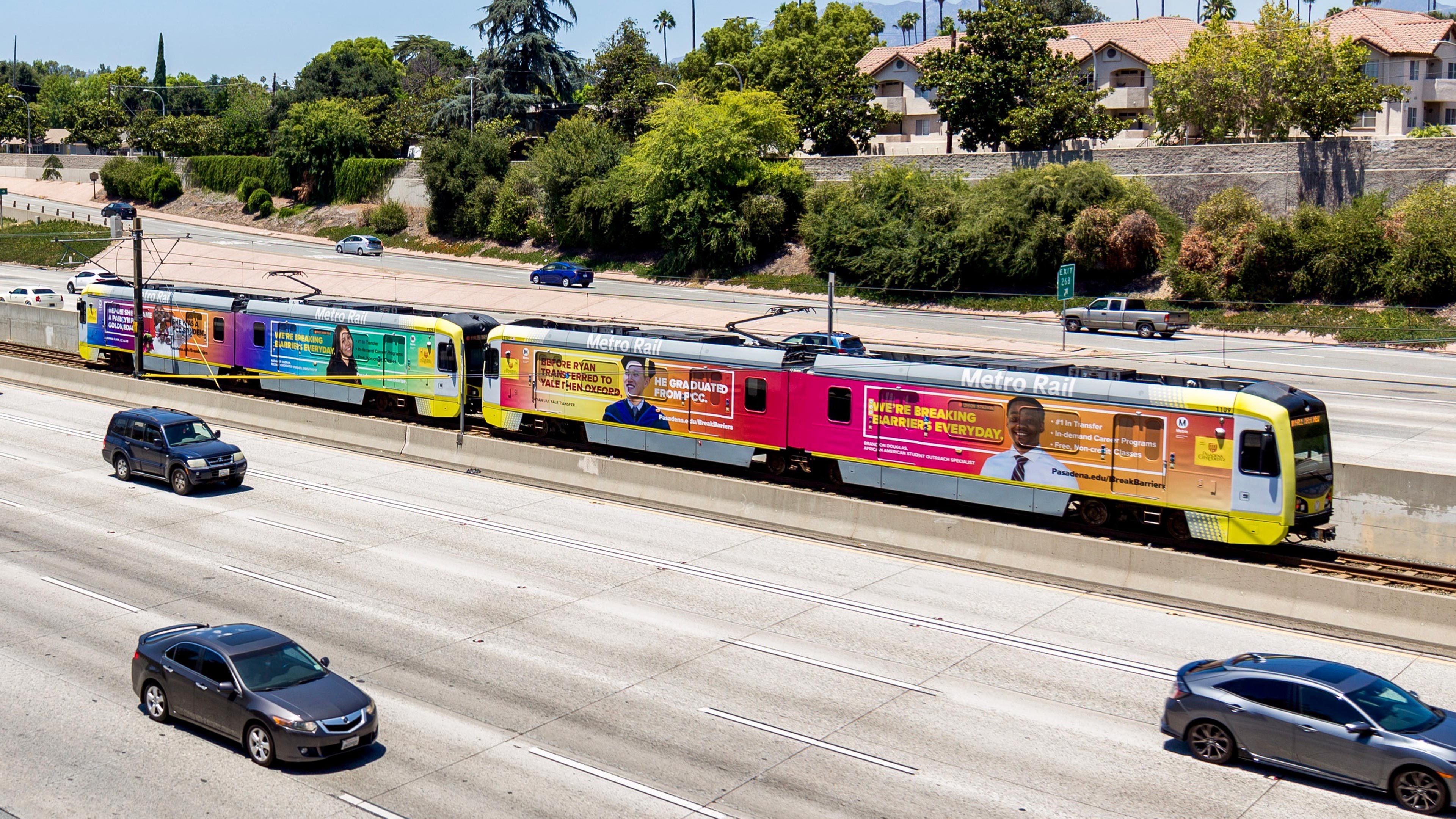 Break Barriers goldline train wrap
