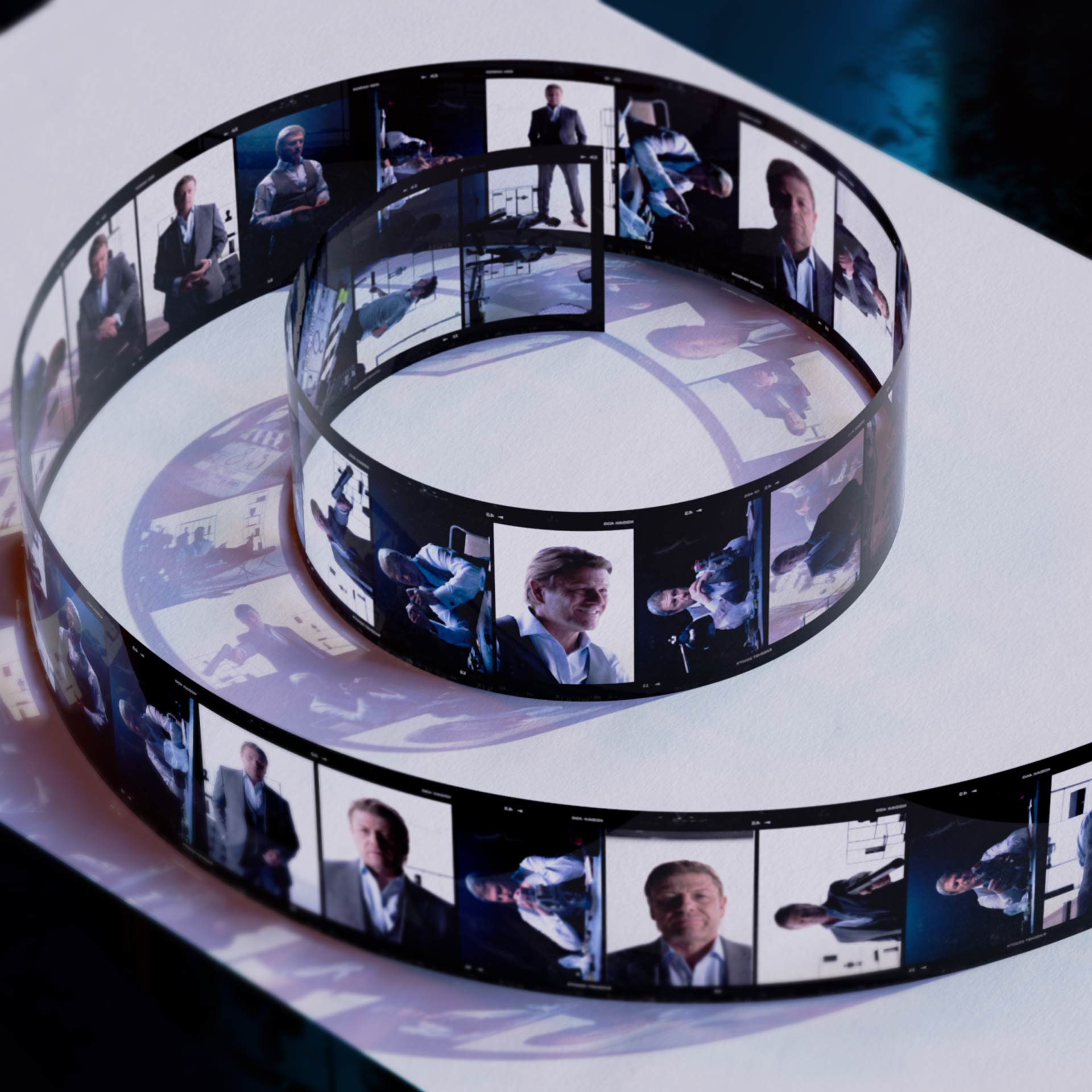 Coiled film strip on a dark surface displaying a sequence of cinematic frames with various scenes, hinting at a narrative flow.