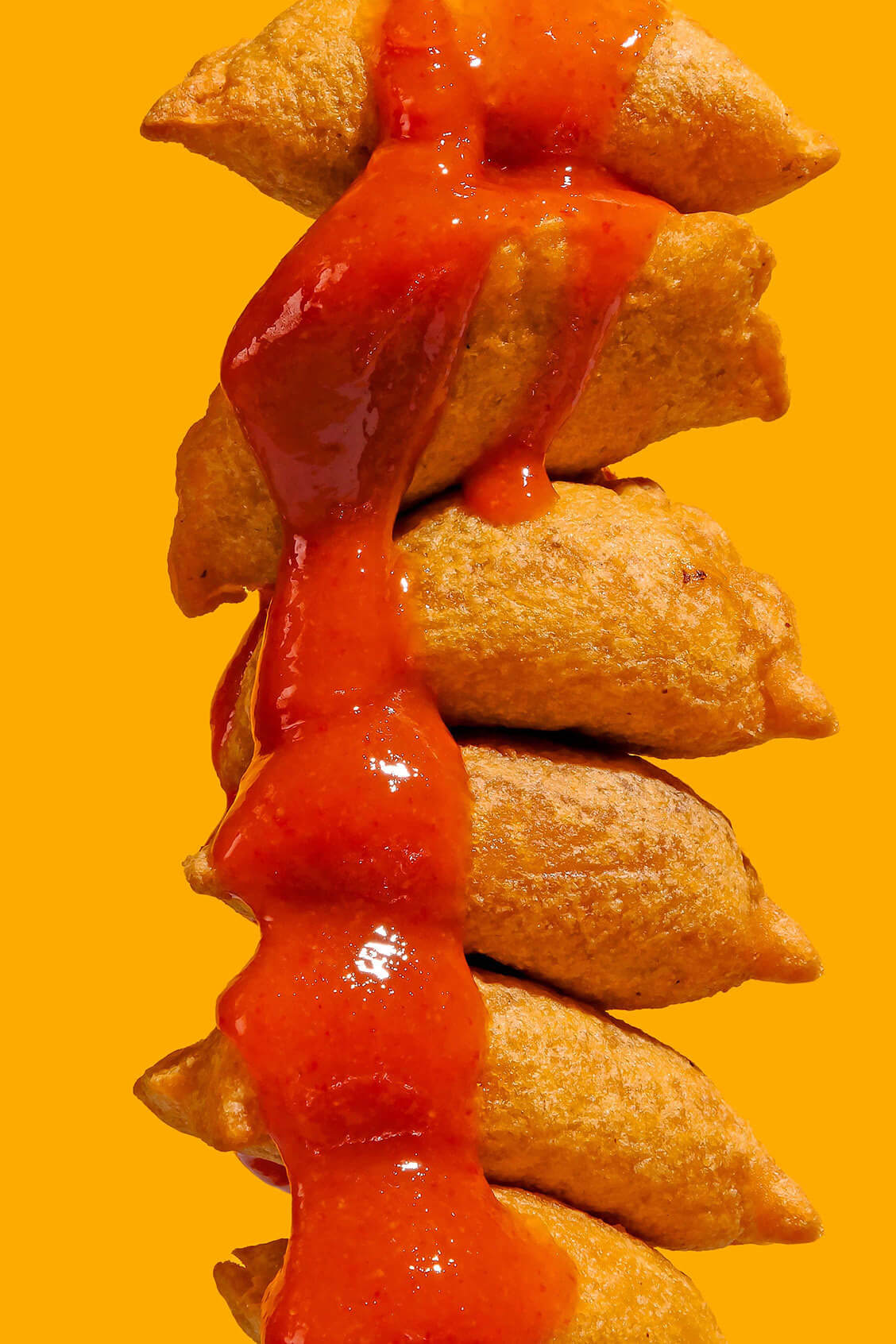 chicken nuggets with hot honey close up on a yellow background