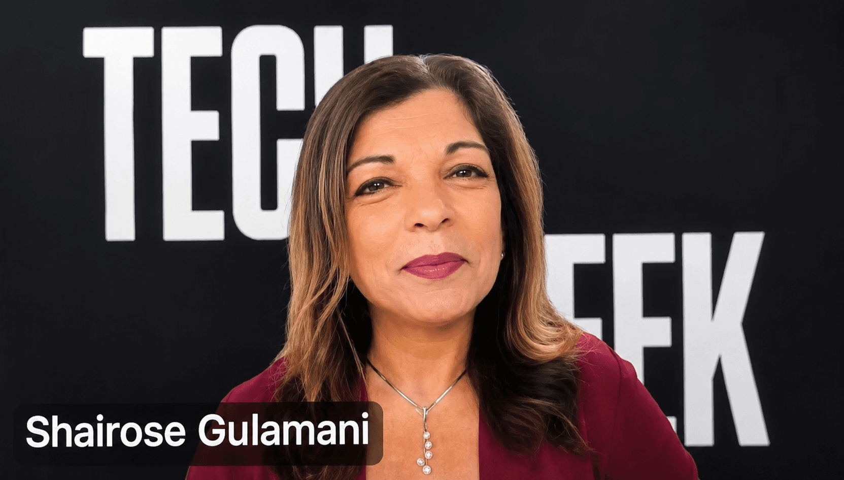 Shairose Gulamani in NY Tech Week 2026. Person with long hair in a red shirt.