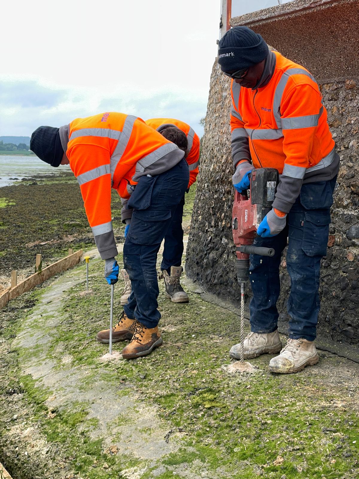 Mainmark technicians stabilising and strengthening a residential seawall