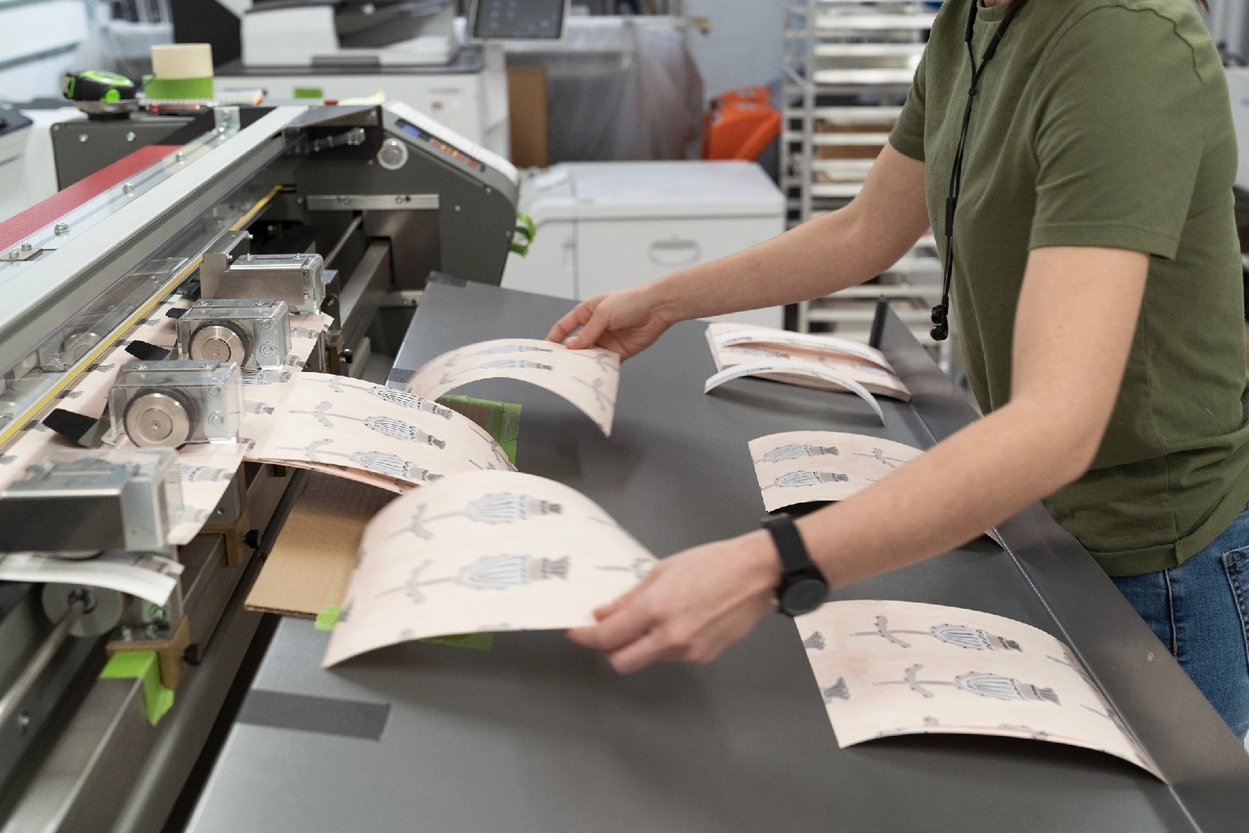 Wallpaper samples being cut.