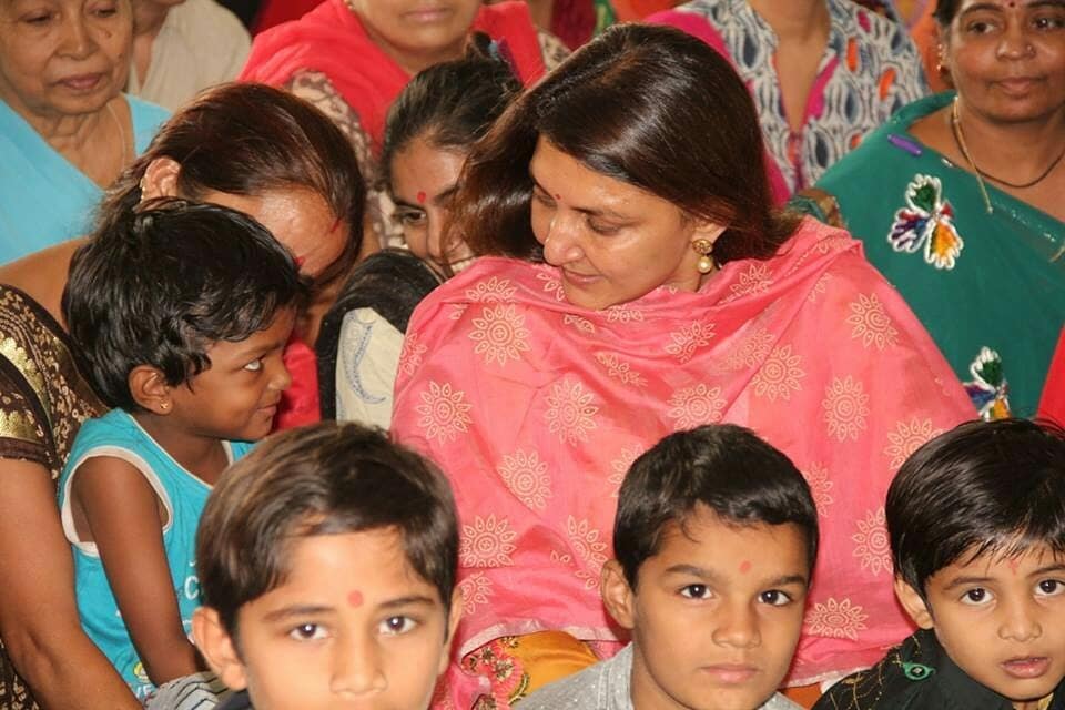 a woman holding an apple