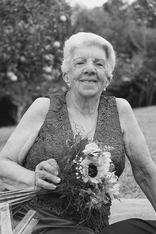 a black and white photo of a woman in a dress