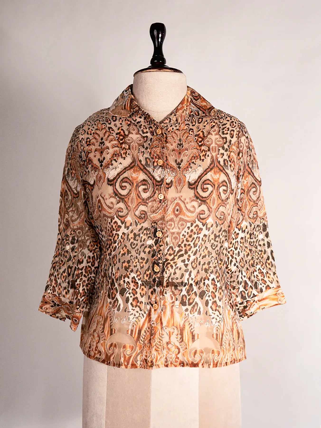 Vintage mixed animal print blouse with 3/4 sleeves.