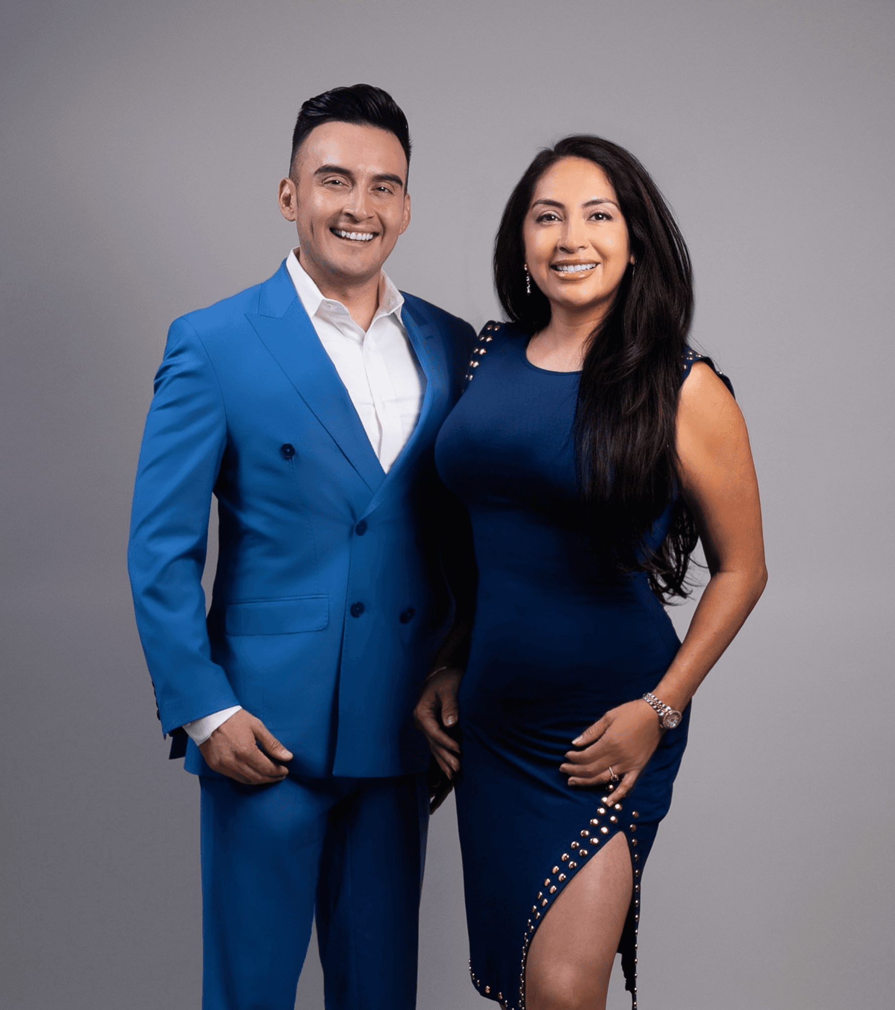 Black and white portrait of a smiling person with curly hair