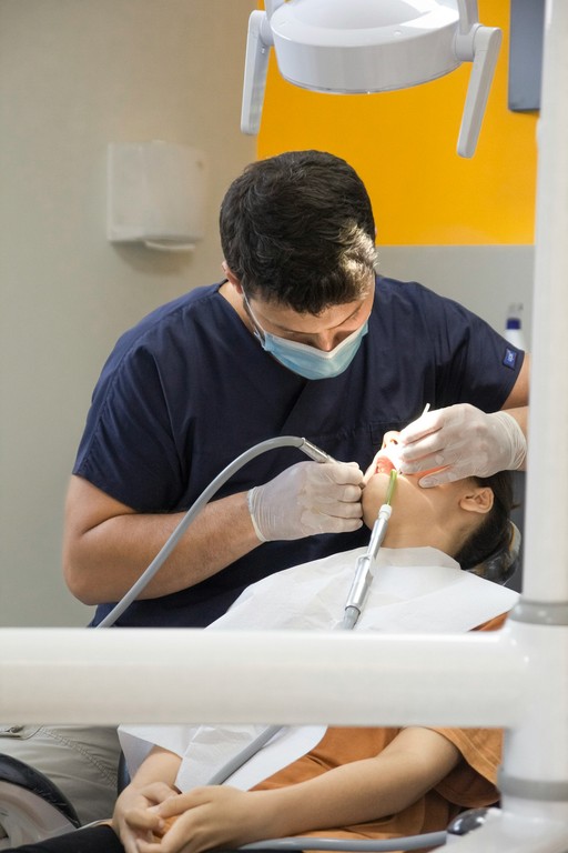 A dentist working on a patient