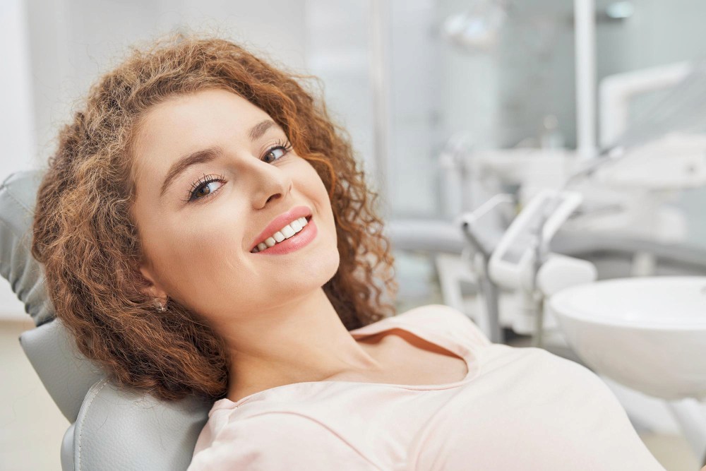 a close up of a woman's mouth with white teeth