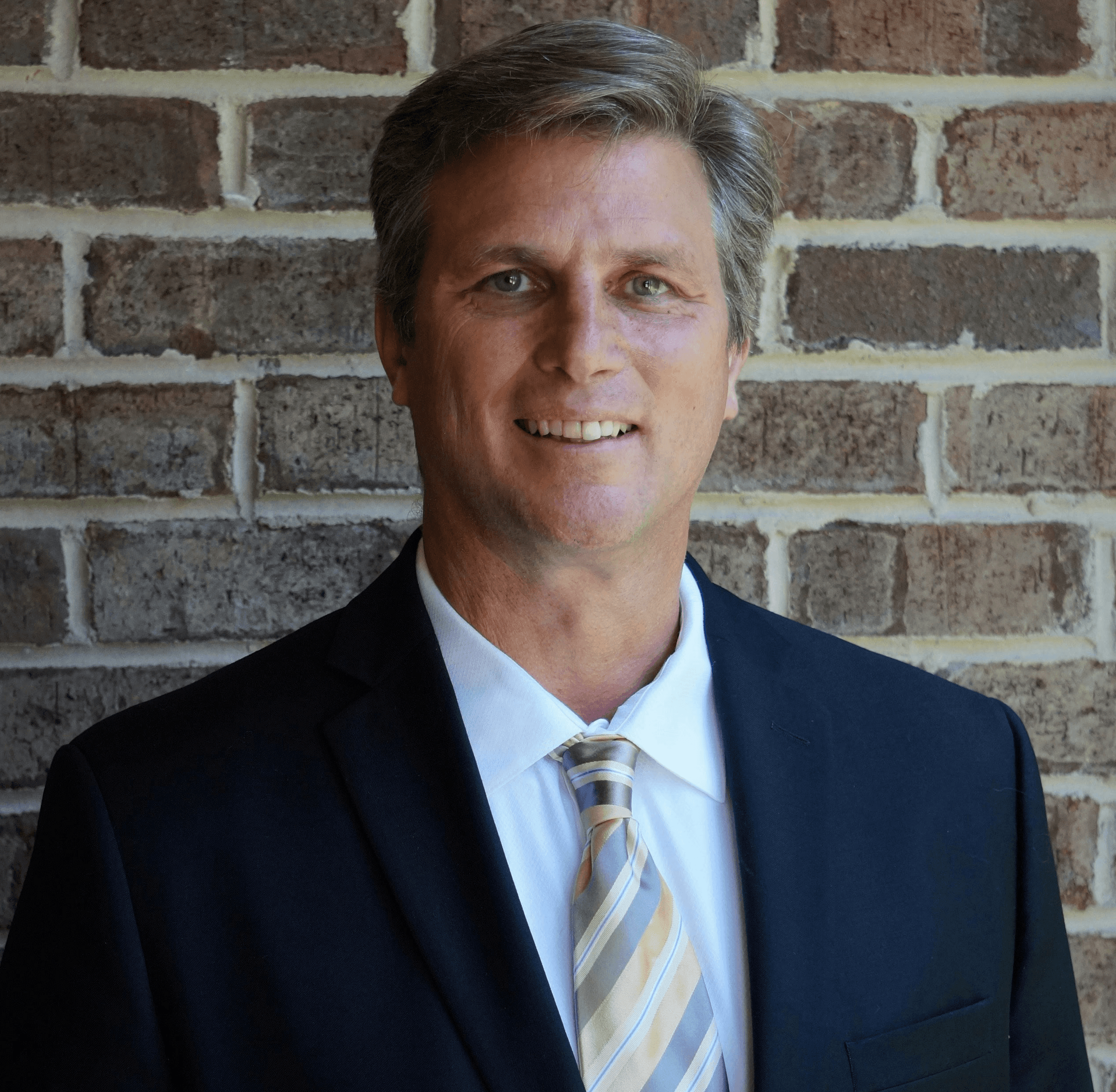portrait photography of man wearing black suit jacket
