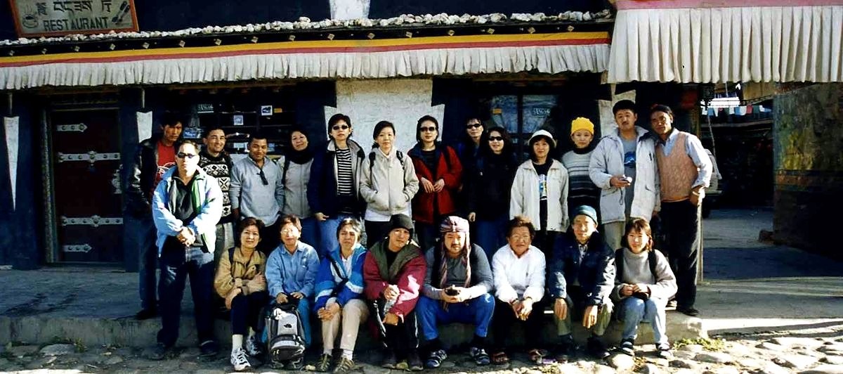 Postak Shrestha with a group of travelers in Tibet