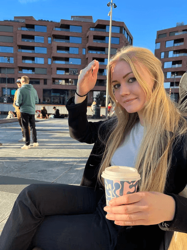 a man with a goatee smiles at the camera