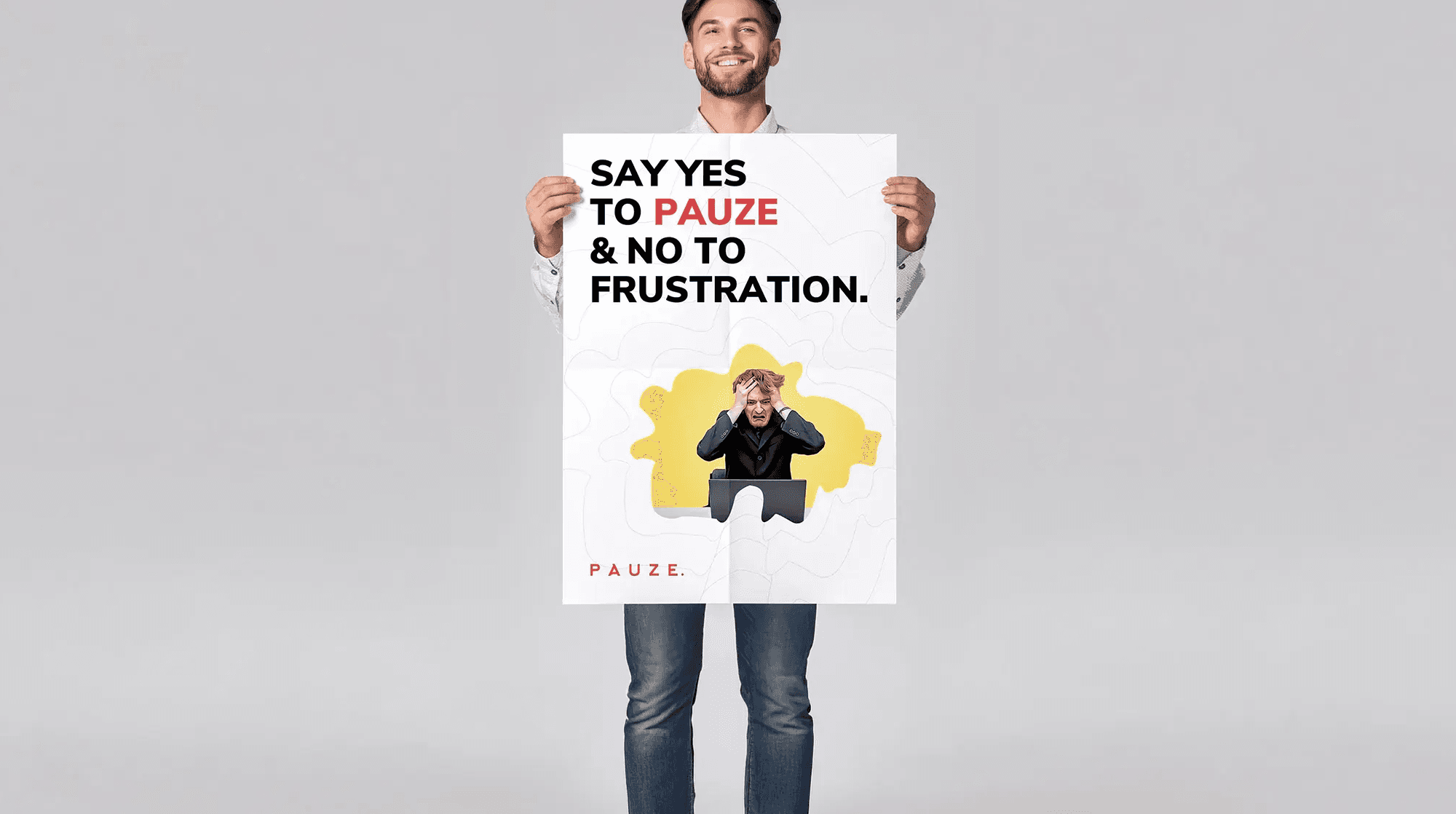Smiling man holds a poster reading “SAY YES TO PAUZE & NO TO FRUSTRATION,” showing a relaxed figure on a yellow splash, promoting calm.