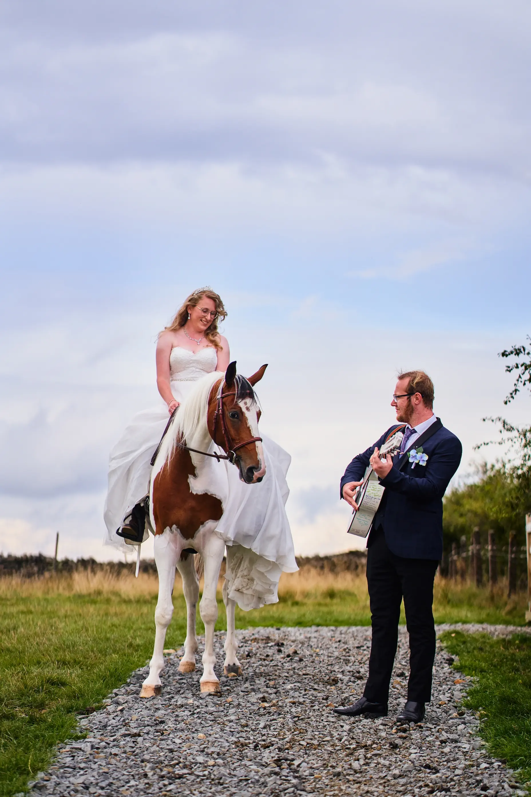 married couple outdoor horse and guitar