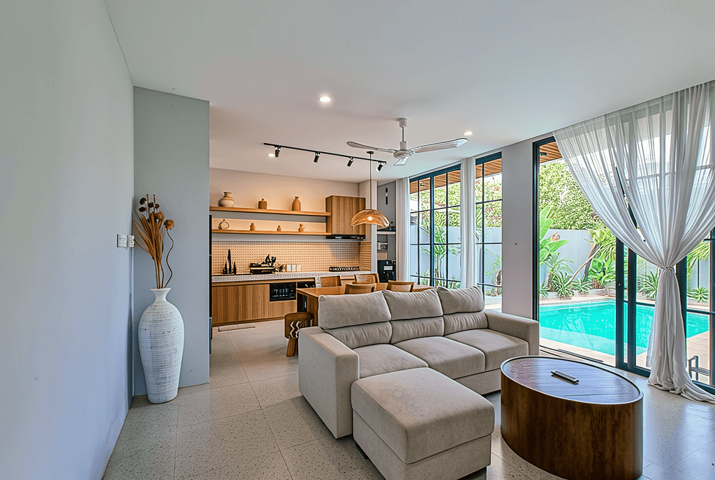 Architectural courtyard with sliding glass doors. Premium real estate consultancy for high-end Pererenan estates.