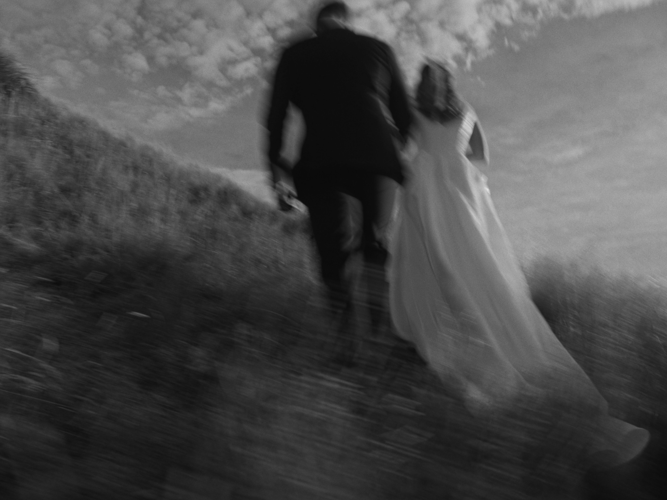 a blurry photo of a person standing in front of a wall