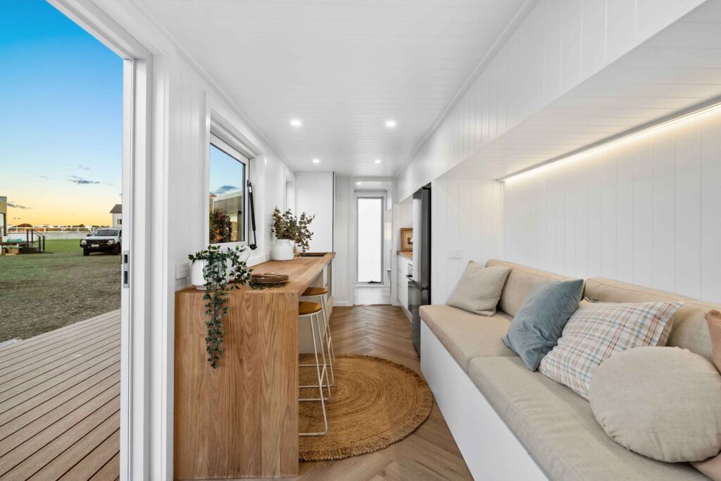 Tiny House Interiro with Daybed and Bar style dining - Iconic Tiny Homes