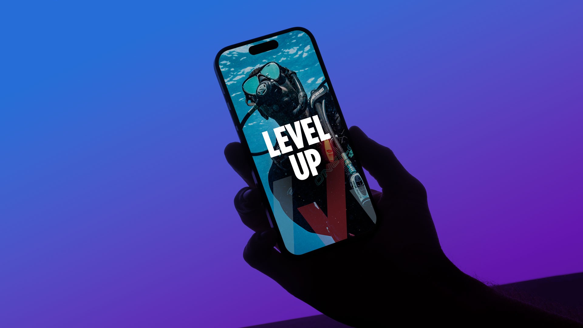 Lifestyle mockup of a Master Scuba Diver mobile campaign asset featuring underwater photography, bold “LEVEL UP” messaging, and immersive achievement-driven branding displayed on a smartphone screen.