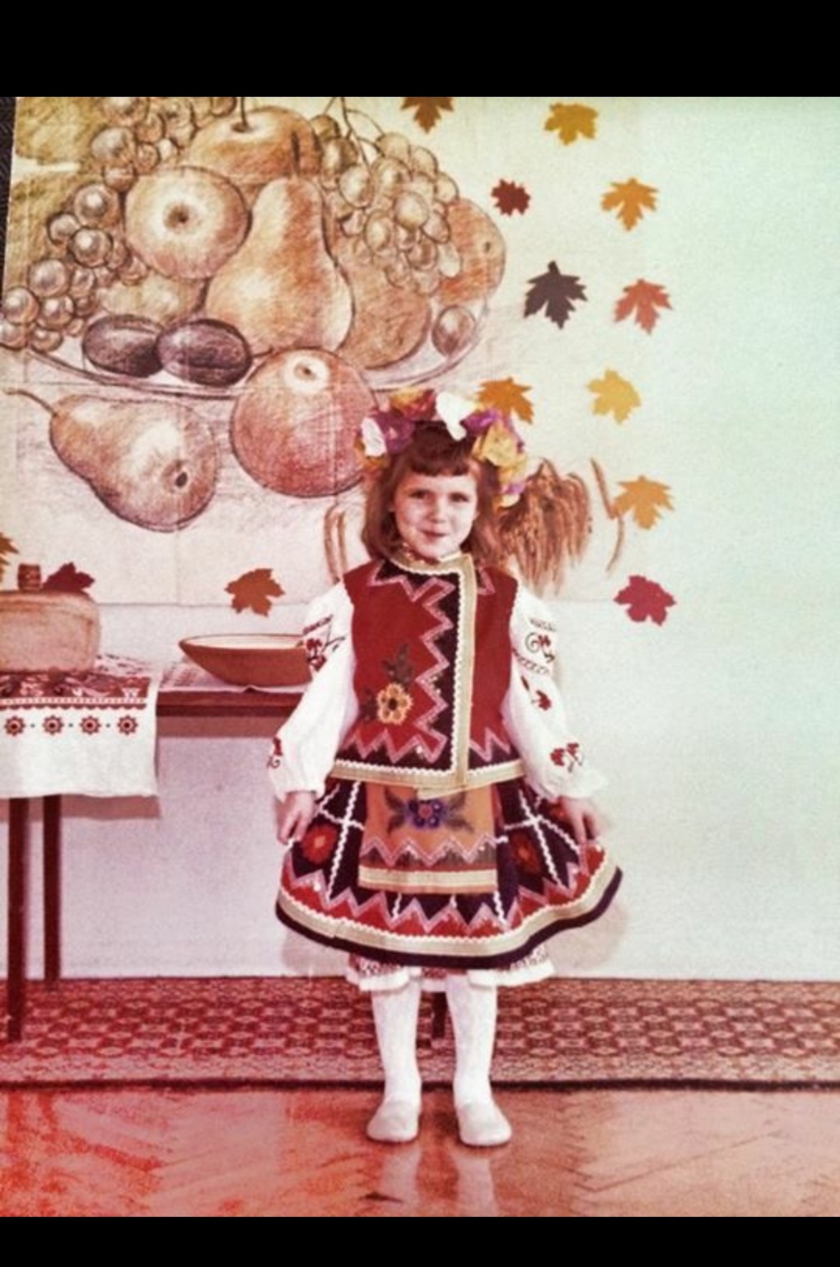 person standing on cliff painting