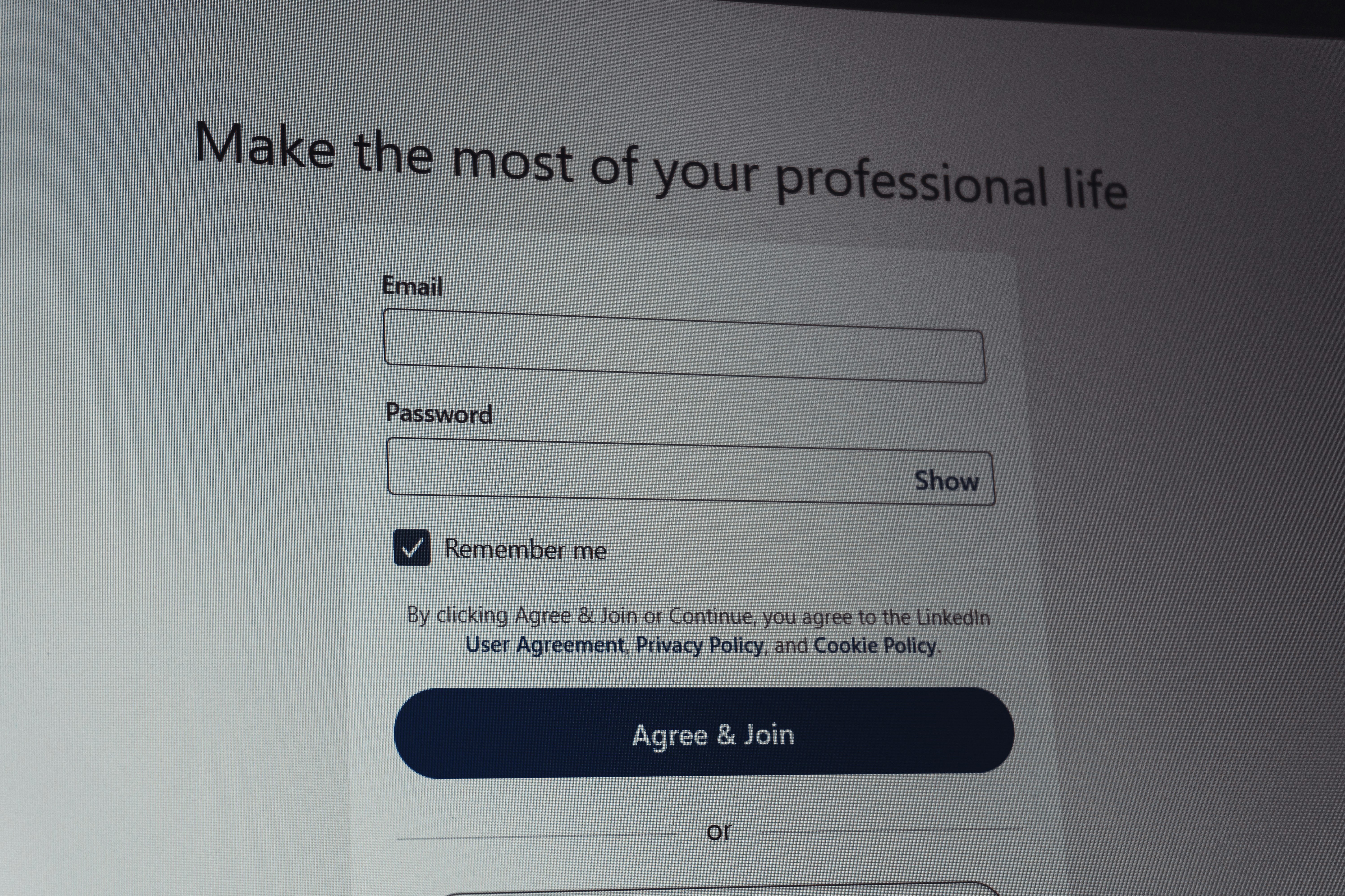 Linkedin login screen with email and password fields.