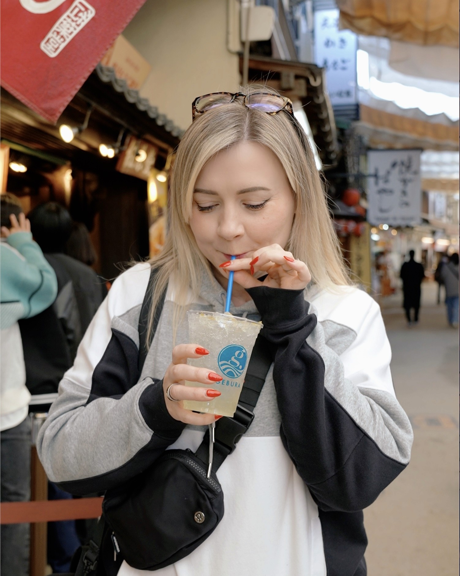 A Geisha holding a red umbrella