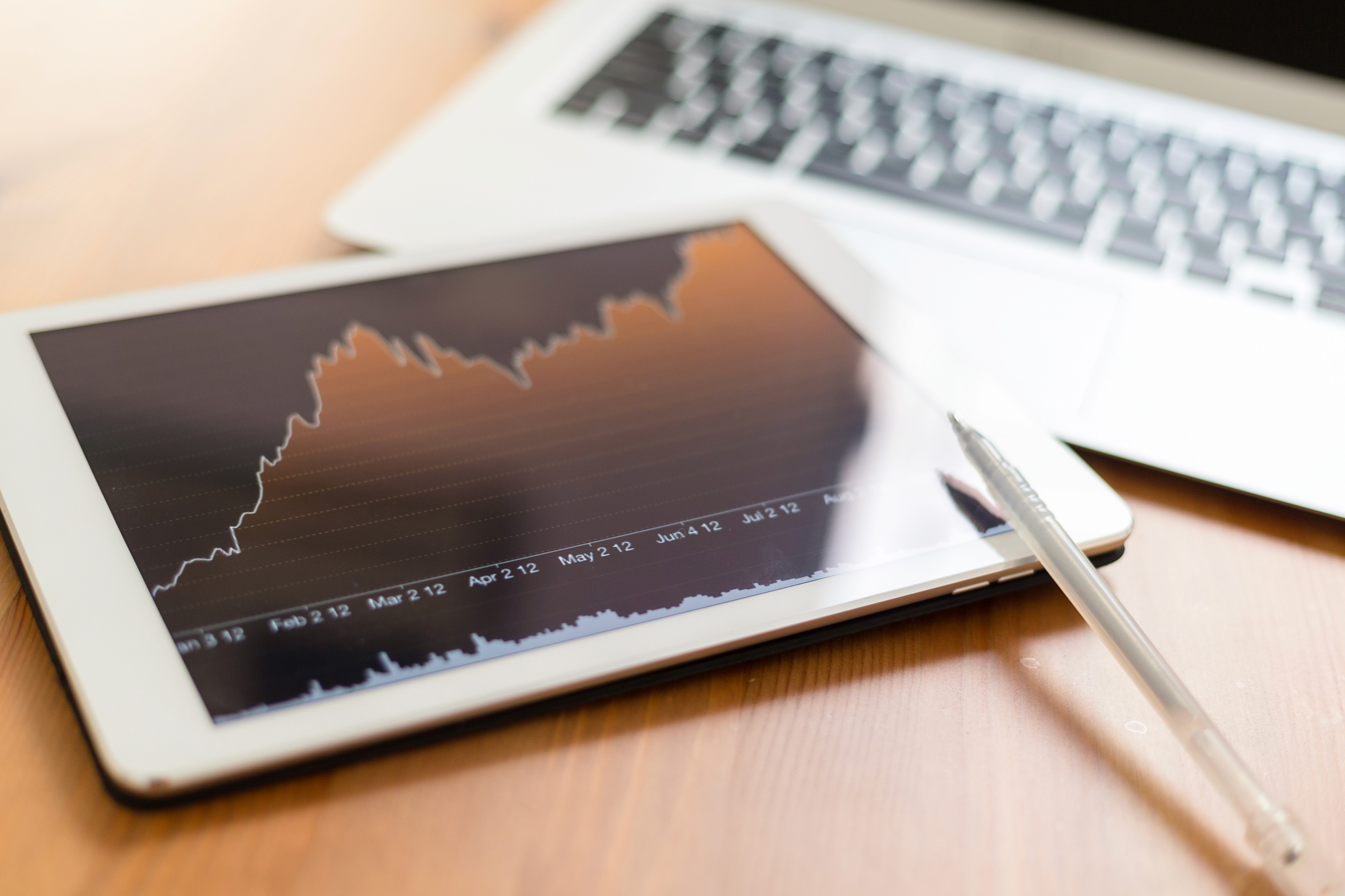 Tablet displaying performance trends and growth metrics, representing data analytics consulting and analytics consulting used to build reliable data analytics insights for commercial decision-making.