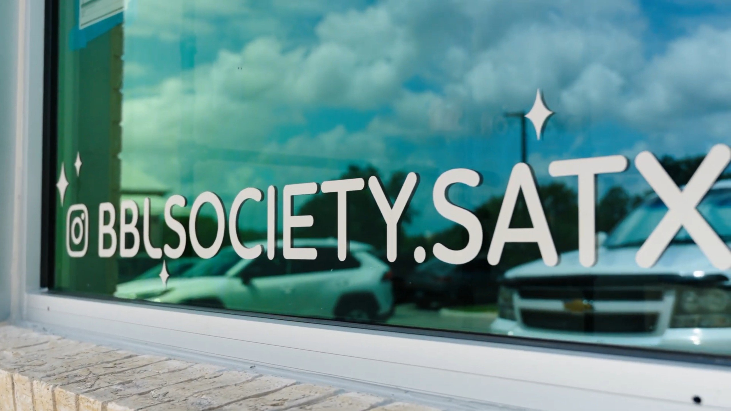BBL Society storefront window with Instagram lettering