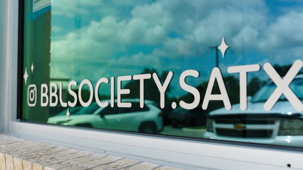 BBL Society storefront window with Instagram lettering