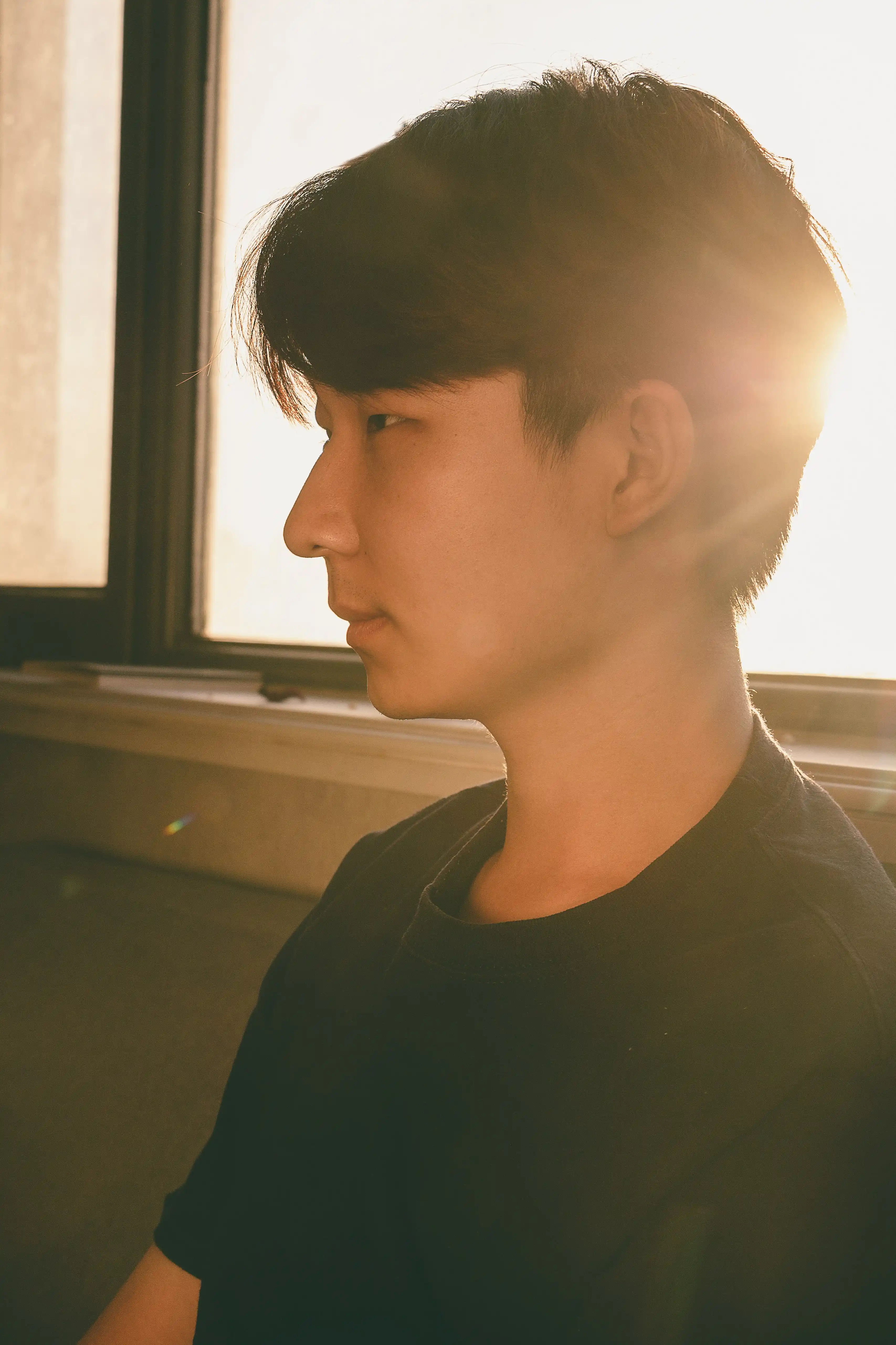 Portait of a young man facing to the right.