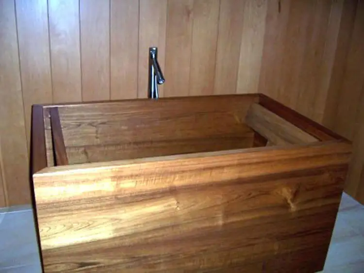 Custom wood soaking tub with floor-mounted filler