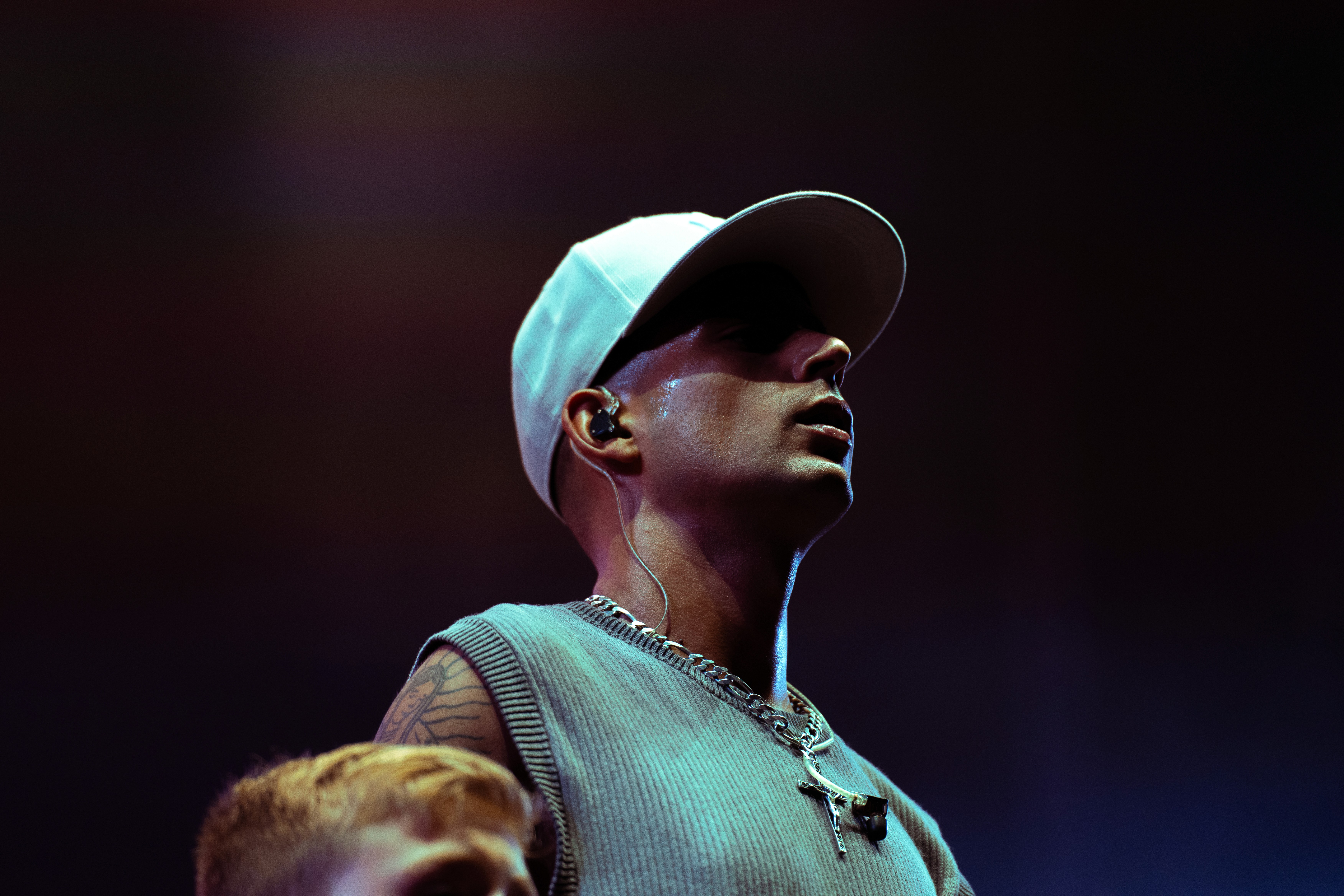  A woman with her eyes closed, wearing a helmet, appears to be in a moment of concentration or relaxation.