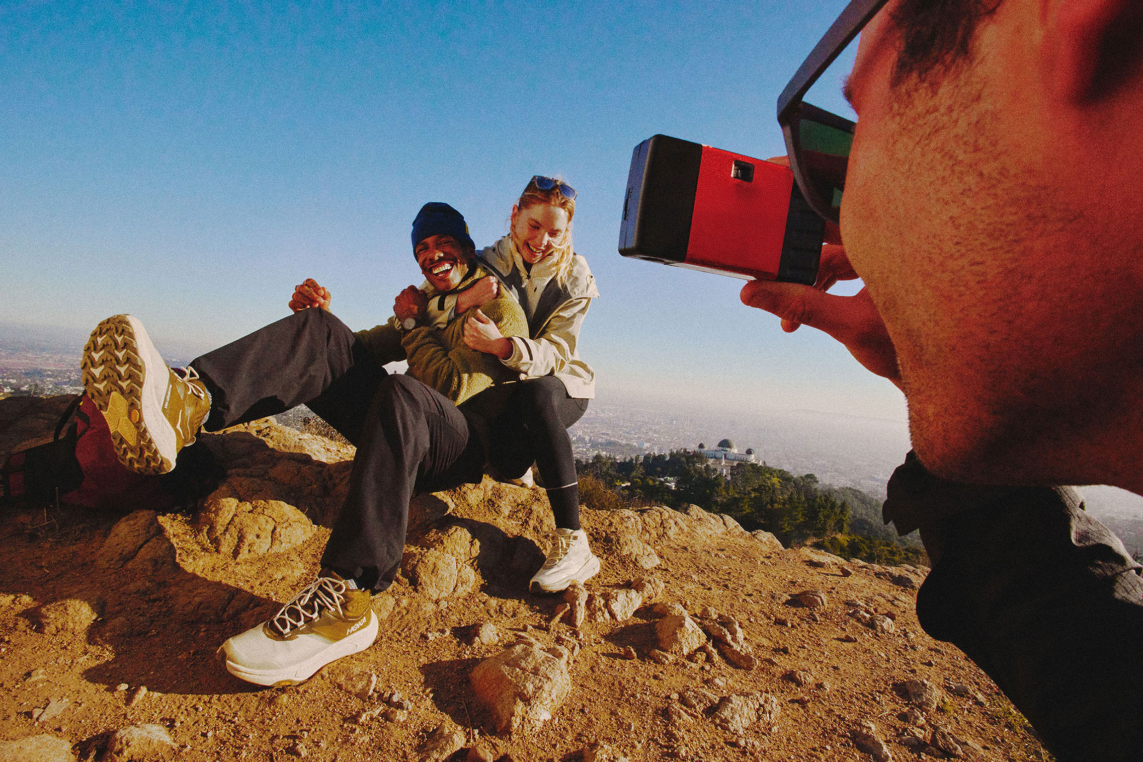 image of people happily posing for a picture up a mountain