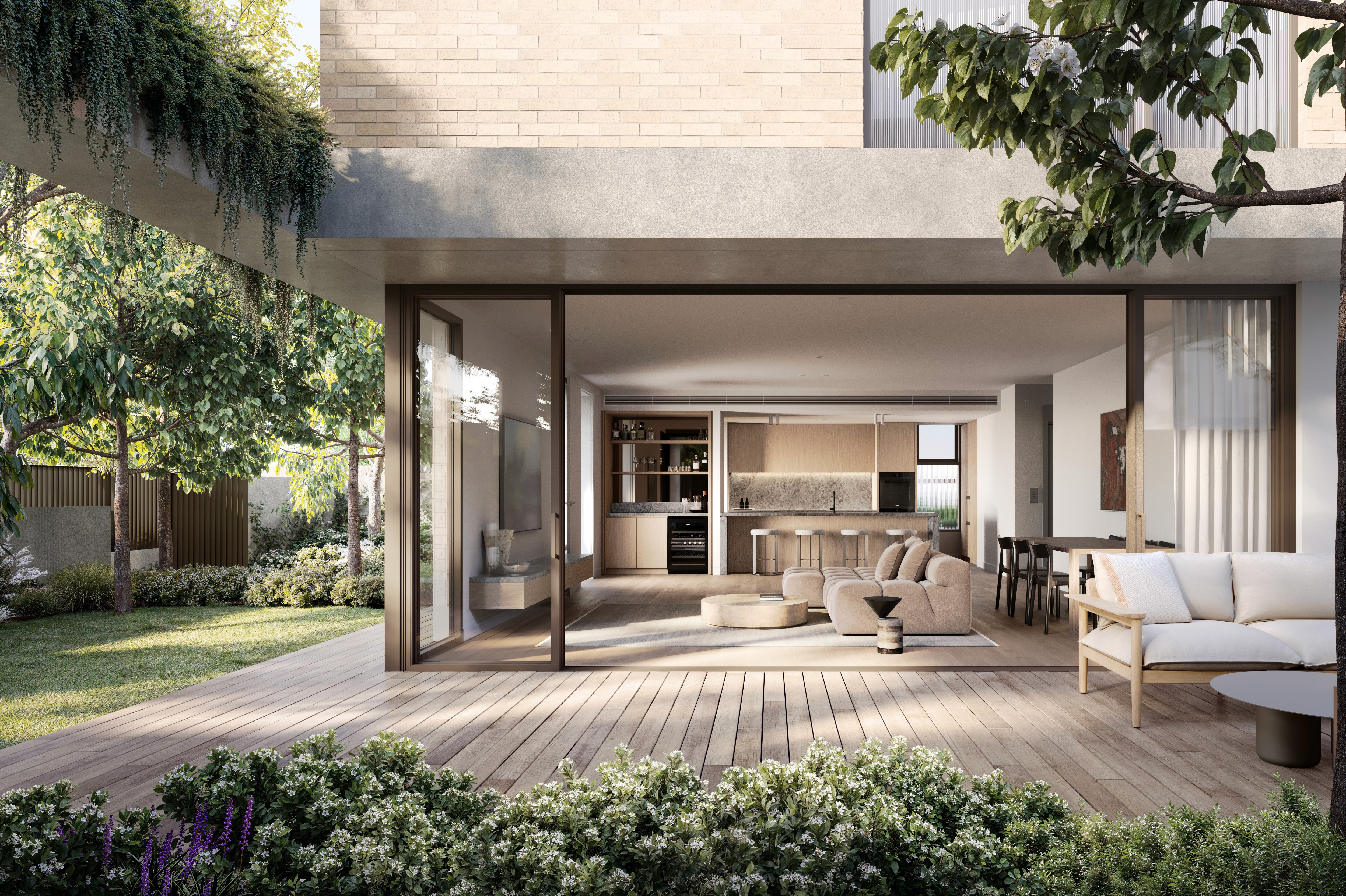 Modern open-plan living room with garden view, wooden deck, and sleek kitchen design.