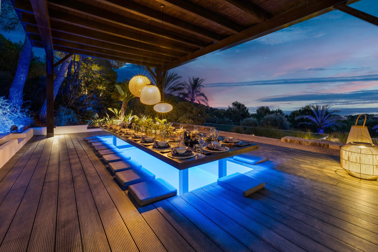 Dining deck at night at an exclusive luxury villa Ibiza—private VIP estate property wedding events holiday retreat