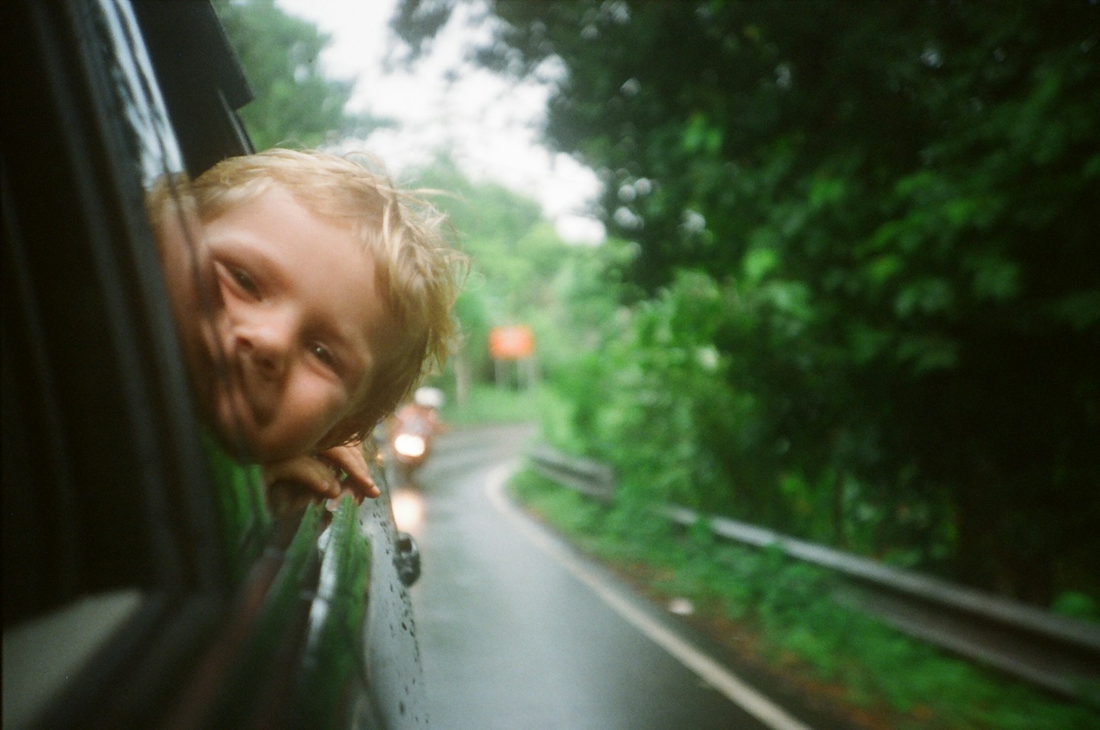 Child looking out of a car window