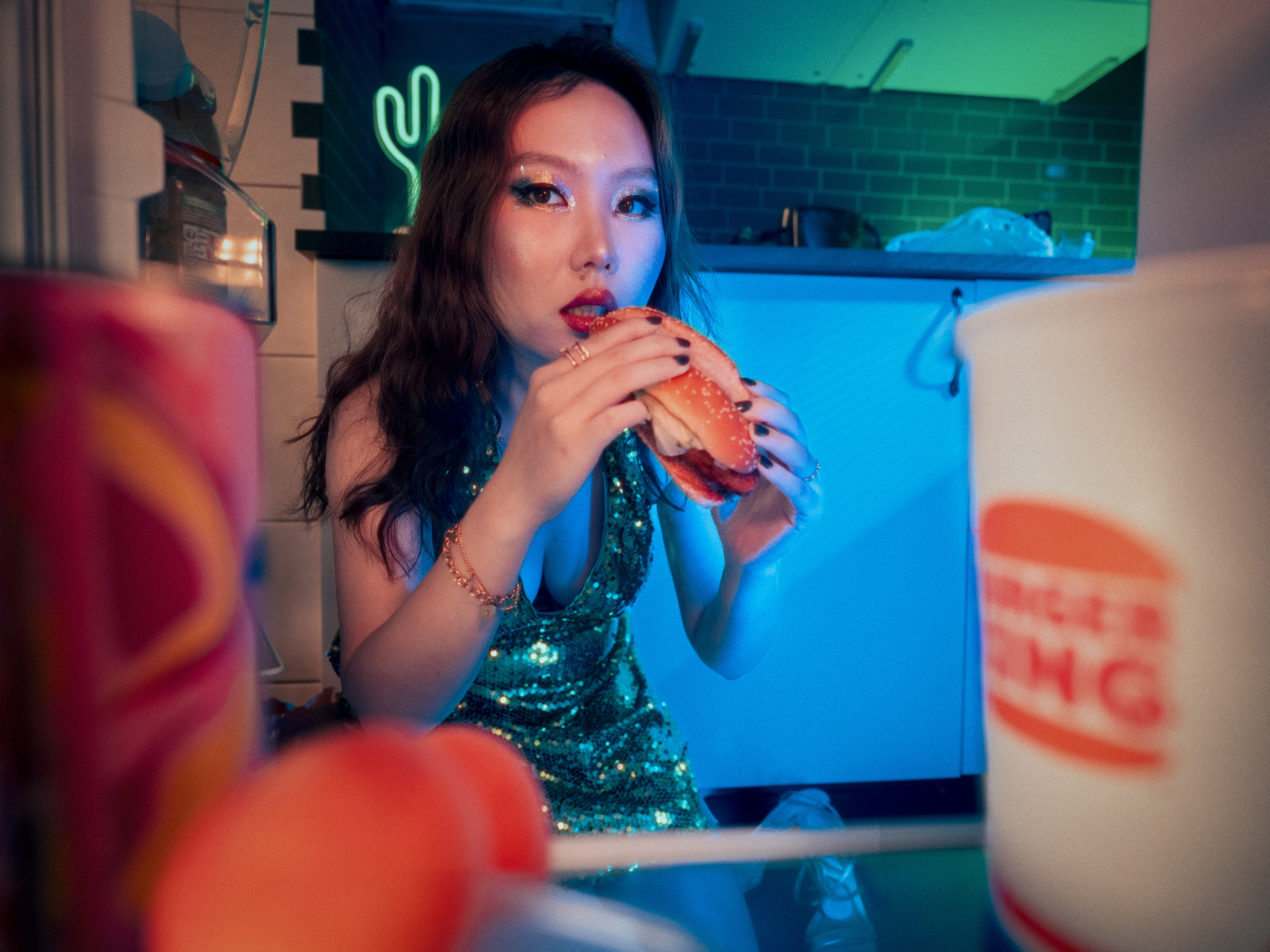 Streetside billboard with flyposters of the Batch.Works brand and illustrations