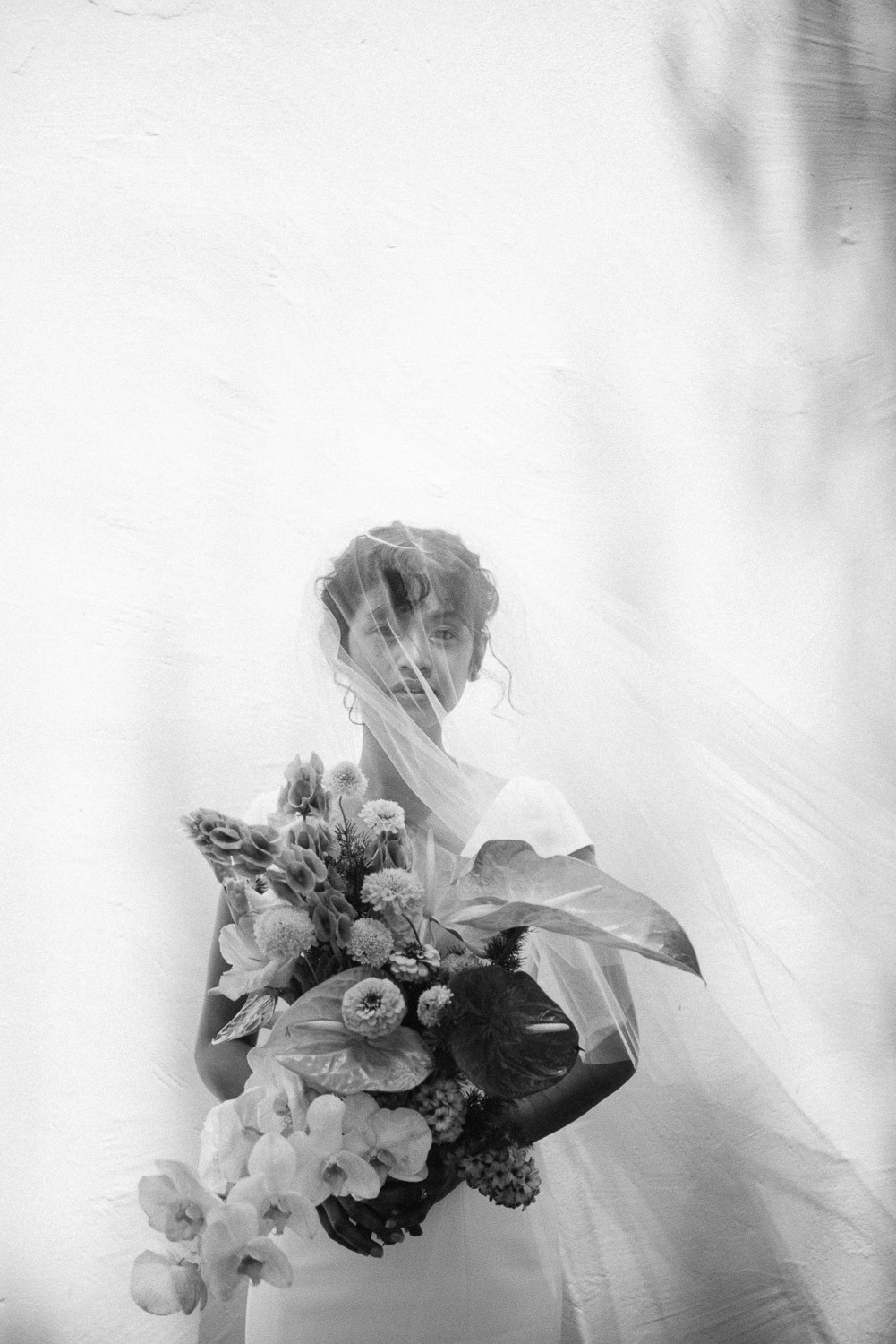 grayscale photo of woman in wedding dress